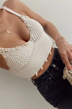 A wholesale clothing model wears max10479-seashell-and-beaded-strap-knitted-bustier-blouse-ecru, Turkish wholesale Crop Top of Maxi Modena