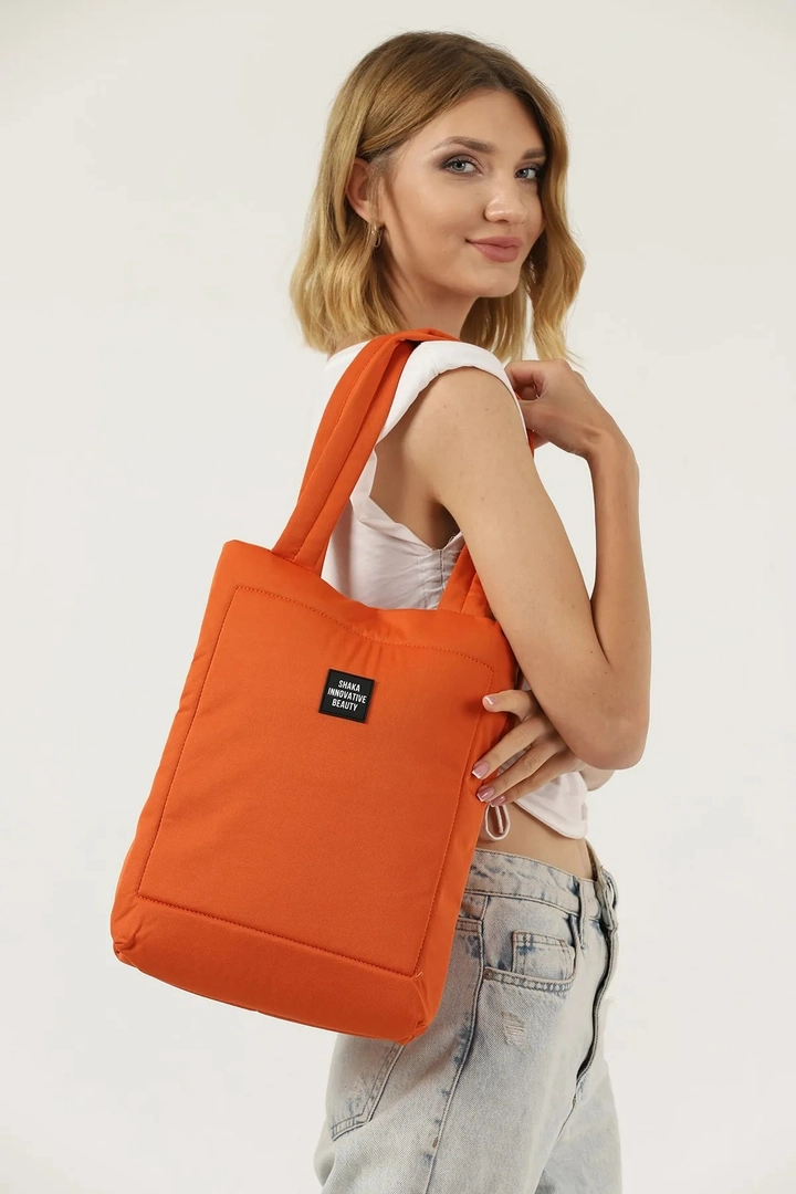 A wholesale clothing model wears mna10430-canvas-daily-hand-and-shoulder-bag-with-snap-closure-and-2-back-pockets-detail, Turkish wholesale Bag of Mina Fashion