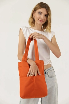 A wholesale clothing model wears mna10430-canvas-daily-hand-and-shoulder-bag-with-snap-closure-and-2-back-pockets-detail, Turkish wholesale Bag of Mina Fashion