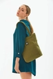 A wholesale clothing model wears mna10480-canvas-daily-hand-and-shoulder-bag-with-snap-closure-and-2-back-pockets-detail, Turkish wholesale  of 