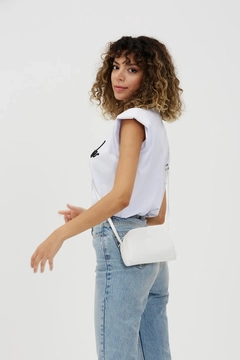 A wholesale clothing model wears mna10482-mini-urban-cross-strap-single-compartment-faux-leather-shoulder-bag, Turkish wholesale Bag of Mina Fashion