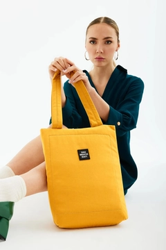 A wholesale clothing model wears mna10558-canvas-daily-hand-and-shoulder-bag-with-snap-closure-and-2-back-pockets-detail, Turkish wholesale Bag of Mina Fashion