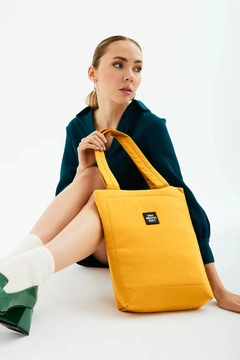A wholesale clothing model wears mna10558-canvas-daily-hand-and-shoulder-bag-with-snap-closure-and-2-back-pockets-detail, Turkish wholesale Bag of Mina Fashion