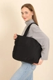 A wholesale clothing model wears mna10560-canvas-shoulder-bag-with-3-compartments-and-2-side-pockets-with-zipper-closure, Turkish wholesale  of 