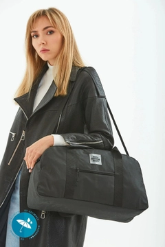 A wholesale clothing model wears mna10699-waterproof-travel-fitness-and-sports-bag-with-front-pocket-detail-and-adjustable-strap, Turkish wholesale Bag of Mina Fashion