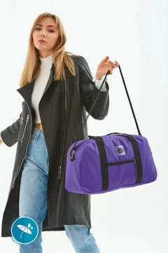 A wholesale clothing model wears mna10700-waterproof-travel-fitness-and-sports-bag-with-front-pocket-detail-and-adjustable-strap, Turkish wholesale Bag of Mina Fashion