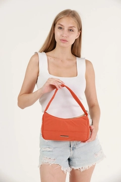 A wholesale clothing model wears mna10728-canvas-fabric-daily-baguette-hand-and-shoulder-bag-with-single-zipper-compartment, Turkish wholesale Bag of Mina Fashion