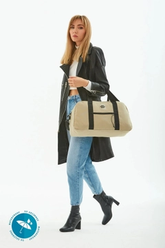 A wholesale clothing model wears mna10736-waterproof-travel-fitness-and-sports-bag-with-front-pocket-detail-and-adjustable-strap, Turkish wholesale Bag of Mina Fashion