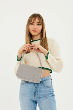 A wholesale clothing model wears mna10763-single-compartment-canvas-fabric-daily-sports-baguette-hand-and-shoulder-bag, Turkish wholesale Bag of Mina Fashion