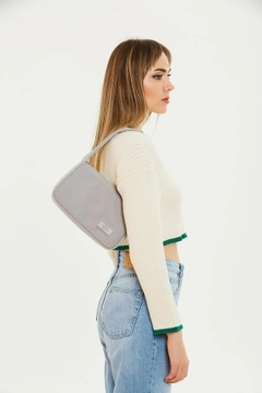 A wholesale clothing model wears mna10763-single-compartment-canvas-fabric-daily-sports-baguette-hand-and-shoulder-bag, Turkish wholesale Bag of Mina Fashion