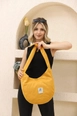 A wholesale clothing model wears mna10843-casual-model-canvas-fabric-daily-shoulder-bag-with-adjustable-fastening-strap, Turkish wholesale  of 