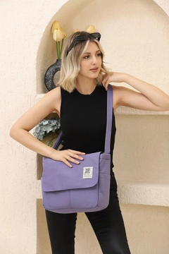 A wholesale clothing model wears mna10877-postman-model-5-compartment-adjustable-strap-daily-unisex-arm-and-shoulder-bag, Turkish wholesale Bag of Mina Fashion