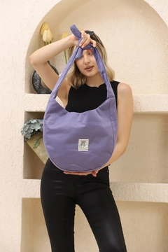 A wholesale clothing model wears mna10884-casual-model-canvas-fabric-daily-shoulder-bag-with-adjustable-fastening-strap, Turkish wholesale Bag of Mina Fashion