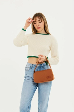 A wholesale clothing model wears mna10918-single-compartment-canvas-fabric-daily-sports-baguette-hand-and-shoulder-bag, Turkish wholesale Bag of Mina Fashion