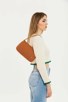 A wholesale clothing model wears mna10918-single-compartment-canvas-fabric-daily-sports-baguette-hand-and-shoulder-bag, Turkish wholesale Bag of Mina Fashion