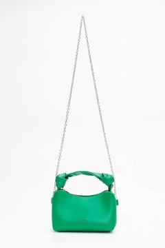 A wholesale clothing model wears mna10002-original-soft-leather-hand-and-shoulder-bag-with-knot-detail-and-chain-strap, Turkish wholesale Bag of Mina Fashion