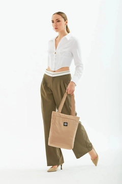 A wholesale clothing model wears mna10026-canvas-daily-hand-and-shoulder-bag-with-snap-closure-and-2-back-pockets-detail, Turkish wholesale Bag of Mina Fashion