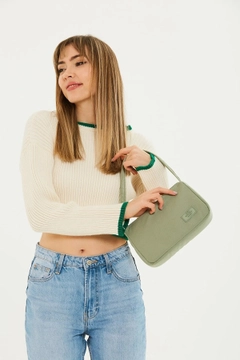 A wholesale clothing model wears mna10059-single-compartment-canvas-fabric-daily-sports-baguette-hand-and-shoulder-bag, Turkish wholesale Bag of Mina Fashion