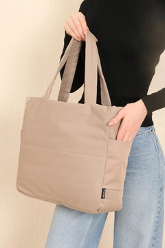A wholesale clothing model wears mna10074-canvas-shoulder-bag-with-3-compartments-and-2-side-pockets-with-zipper-closure, Turkish wholesale Bag of Mina Fashion