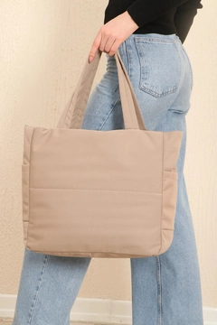 A wholesale clothing model wears mna10074-canvas-shoulder-bag-with-3-compartments-and-2-side-pockets-with-zipper-closure, Turkish wholesale Bag of Mina Fashion