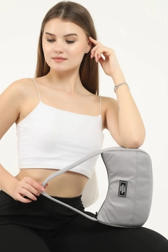 A wholesale clothing model wears mna10093-daily-sports-baguette-canvas-fabric-hand-and-shoulder-bag-with-single-zipper-compartment, Turkish wholesale Bag of Mina Fashion