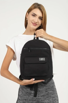 A wholesale clothing model wears mna10103-canvas-fabric-unisex-backpack-with-3-compartments-front-pocket-detail, Turkish wholesale Bag of Mina Fashion