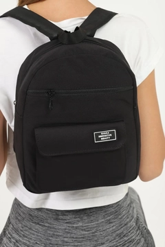 A wholesale clothing model wears mna10103-canvas-fabric-unisex-backpack-with-3-compartments-front-pocket-detail, Turkish wholesale Bag of Mina Fashion