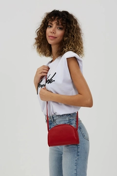 A wholesale clothing model wears mna10140-mini-urban-cross-strap-single-compartment-faux-leather-shoulder-bag, Turkish wholesale Bag of Mina Fashion