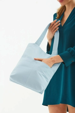 A wholesale clothing model wears mna10195-canvas-daily-hand-and-shoulder-bag-with-snap-closure-and-2-back-pockets-detail, Turkish wholesale Bag of Mina Fashion