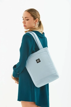 A wholesale clothing model wears mna10195-canvas-daily-hand-and-shoulder-bag-with-snap-closure-and-2-back-pockets-detail, Turkish wholesale Bag of Mina Fashion
