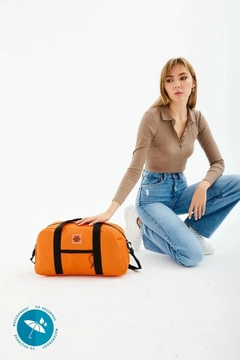 A wholesale clothing model wears mna10212-waterproof-travel-fitness-and-sports-bag-with-front-pocket-detail-and-adjustable-strap, Turkish wholesale Bag of Mina Fashion