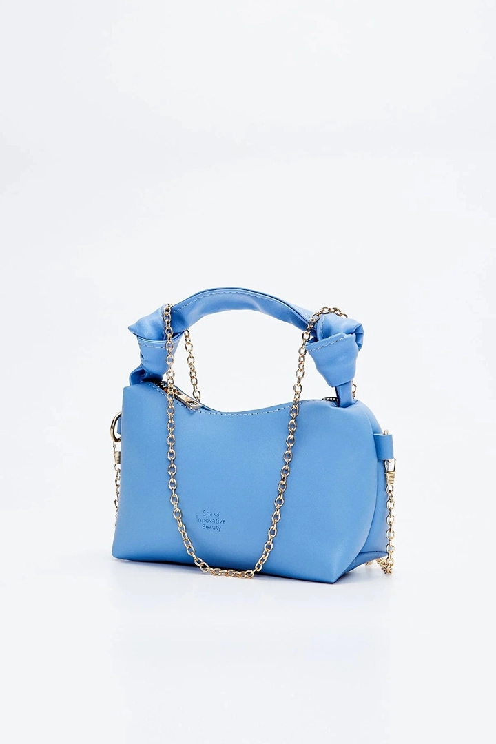 A wholesale clothing model wears mna10215-original-soft-leather-hand-and-shoulder-bag-with-knot-detail-and-chain-strap, Turkish wholesale Bag of Mina Fashion