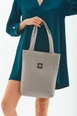 A wholesale clothing model wears mna10241-canvas-daily-hand-and-shoulder-bag-with-snap-closure-and-2-back-pockets-detail, Turkish wholesale  of 