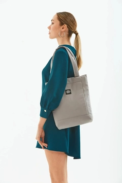 A wholesale clothing model wears mna10241-canvas-daily-hand-and-shoulder-bag-with-snap-closure-and-2-back-pockets-detail, Turkish wholesale Bag of Mina Fashion
