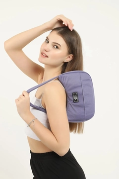 A wholesale clothing model wears mna10254-daily-sports-baguette-canvas-fabric-hand-and-shoulder-bag-with-single-zipper-compartment, Turkish wholesale Bag of Mina Fashion