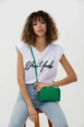 A wholesale clothing model wears mna10269-mini-urban-cross-strap-single-compartment-faux-leather-shoulder-bag, Turkish wholesale  of 