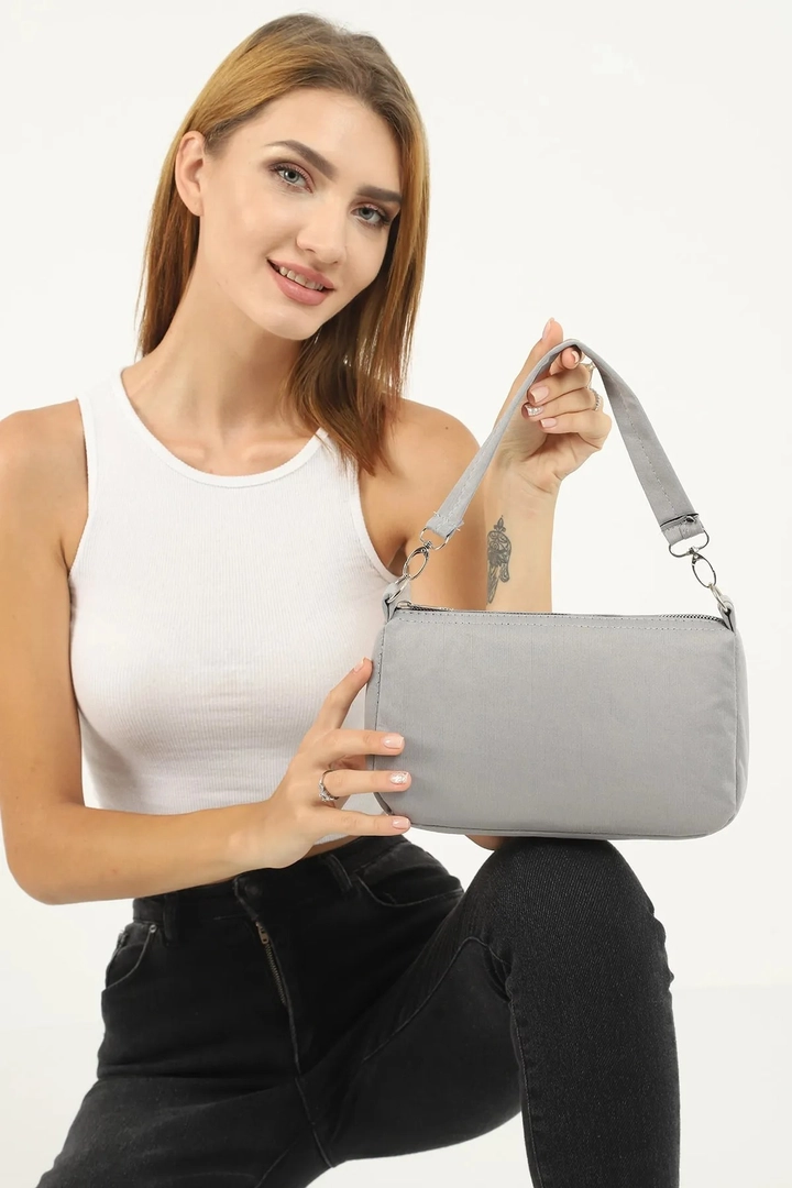 A wholesale clothing model wears mna10289-daily-sports-canvas-fabric-baguette-hand-and-shoulder-bag, Turkish wholesale Bag of Mina Fashion
