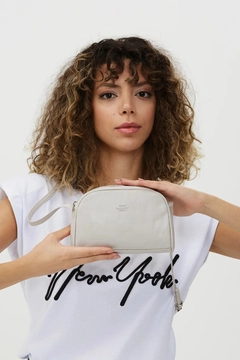 A wholesale clothing model wears mna10295-mini-urban-cross-strap-single-compartment-faux-leather-shoulder-bag, Turkish wholesale Bag of Mina Fashion