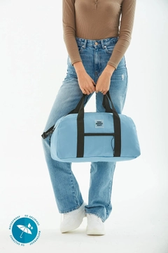 A wholesale clothing model wears mna10302-waterproof-travel-fitness-and-sports-bag-with-front-pocket-detail-and-adjustable-strap, Turkish wholesale Bag of Mina Fashion