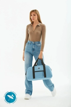 A wholesale clothing model wears mna10302-waterproof-travel-fitness-and-sports-bag-with-front-pocket-detail-and-adjustable-strap, Turkish wholesale Bag of Mina Fashion