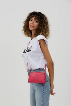 A wholesale clothing model wears mna10305-mini-urban-cross-strap-single-compartment-faux-leather-shoulder-bag, Turkish wholesale Bag of Mina Fashion