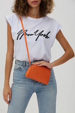A wholesale clothing model wears mna10338-mini-urban-cross-strap-single-compartment-faux-leather-shoulder-bag, Turkish wholesale Bag of Mina Fashion