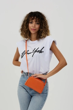 A wholesale clothing model wears mna10338-mini-urban-cross-strap-single-compartment-faux-leather-shoulder-bag, Turkish wholesale Bag of Mina Fashion