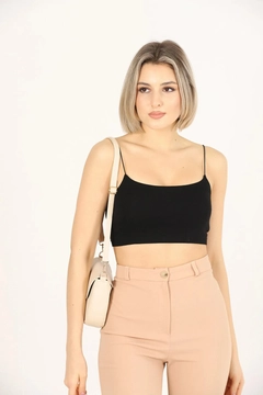 A wholesale clothing model wears mna10341-simple-and-stylish-snap-closure-crossbody-shoulder-bag-with-adjustable-strap, Turkish wholesale Bag of Mina Fashion