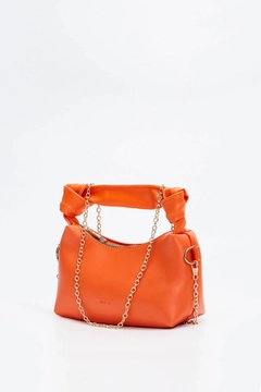 A wholesale clothing model wears mna10342-original-soft-leather-hand-and-shoulder-bag-with-knot-detail-and-chain-strap, Turkish wholesale Bag of Mina Fashion