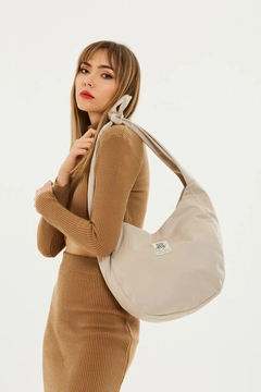 A wholesale clothing model wears mna11023-casual-model-canvas-fabric-daily-shoulder-bag-with-adjustable-fastening-strap, Turkish wholesale Bag of Mina Fashion
