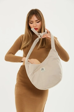 A wholesale clothing model wears mna11023-casual-model-canvas-fabric-daily-shoulder-bag-with-adjustable-fastening-strap, Turkish wholesale Bag of Mina Fashion