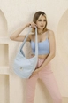 A wholesale clothing model wears mna11027-casual-model-canvas-fabric-daily-shoulder-bag-with-adjustable-fastening-strap, Turkish wholesale  of 