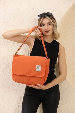 A wholesale clothing model wears mna11052-postman-model-5-compartment-adjustable-strap-daily-unisex-arm-and-shoulder-bag, Turkish wholesale Bag of Mina Fashion
