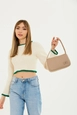 A wholesale clothing model wears mna11053-single-compartment-canvas-fabric-daily-sports-baguette-hand-and-shoulder-bag, Turkish wholesale  of 